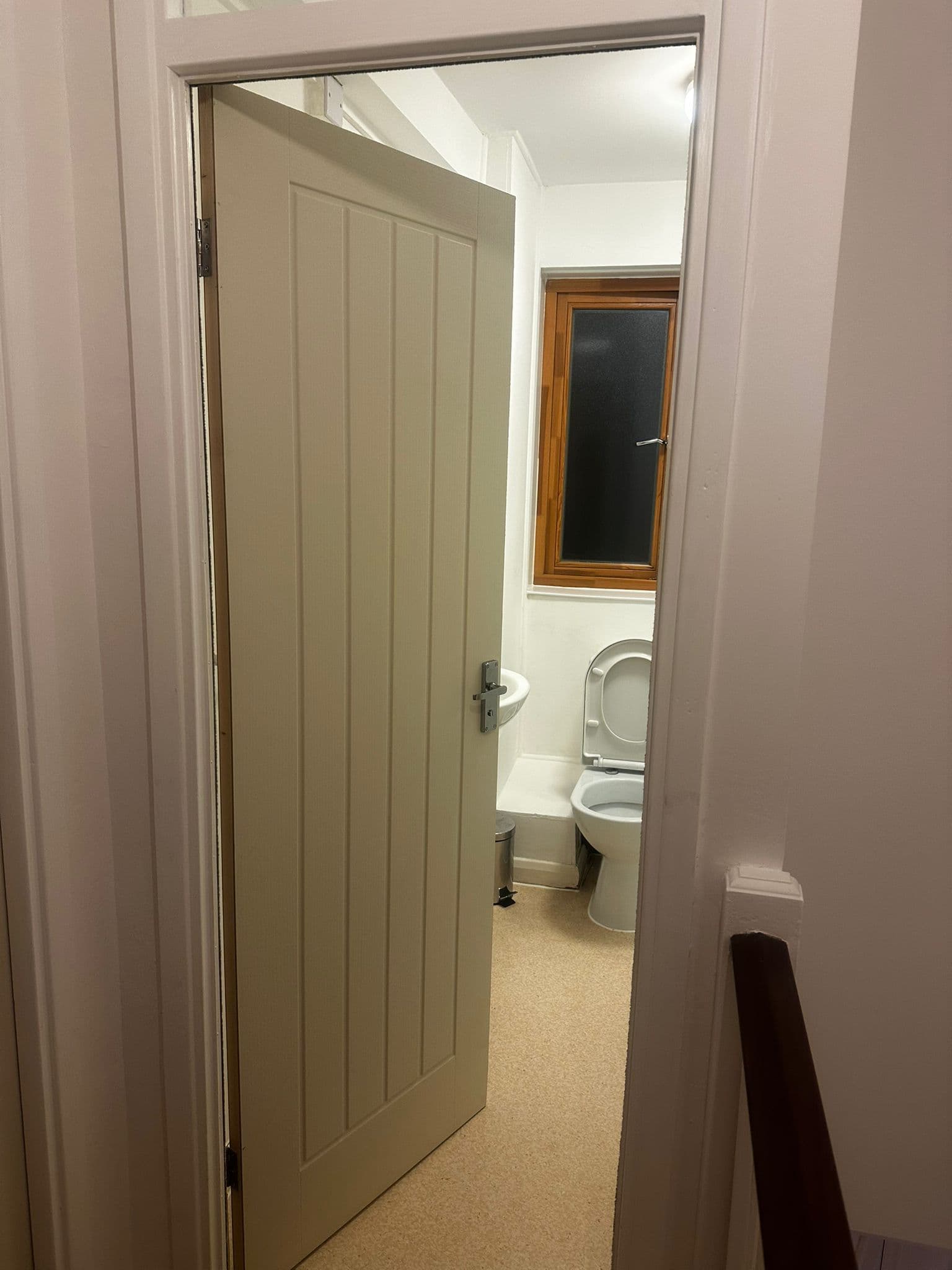 Cottage-style cream internal door open showing bathroom beyond