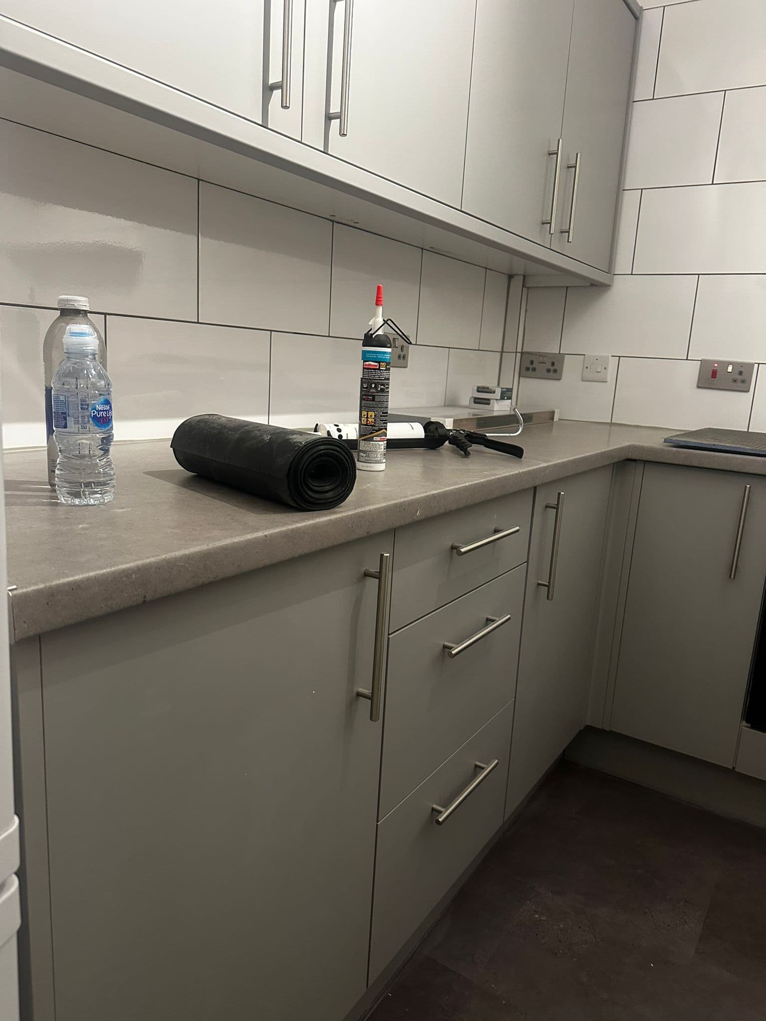 Large dark fitted display cabinet and bookcase with glass doors and oak shelves