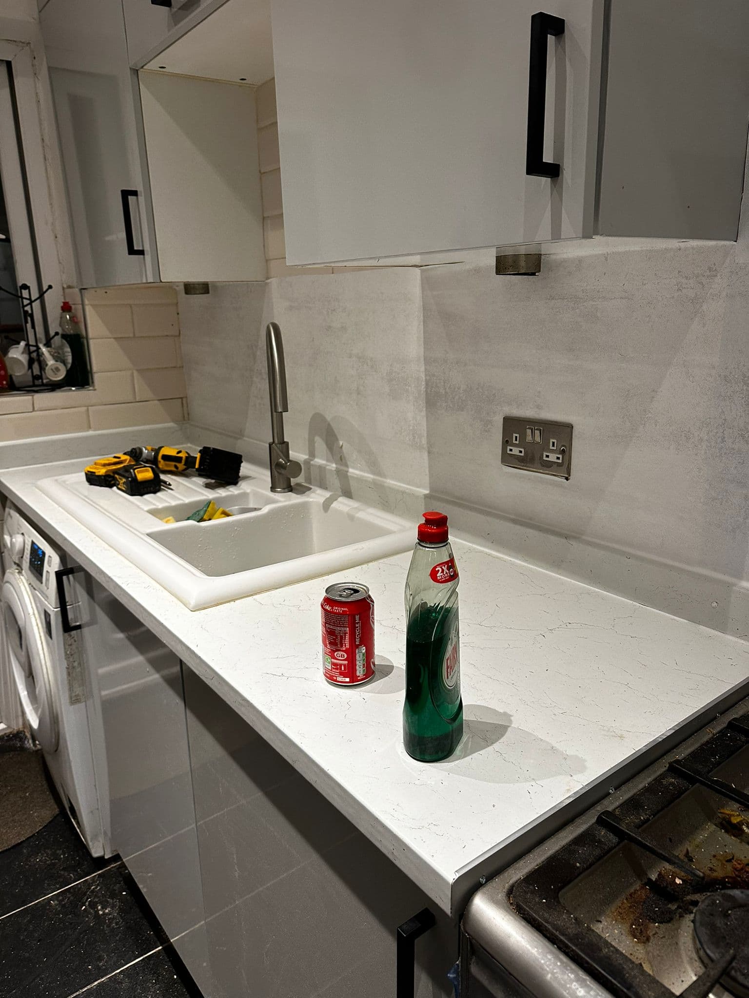 Wall-mounted emergency and utility light fitting with door to commercial corridor