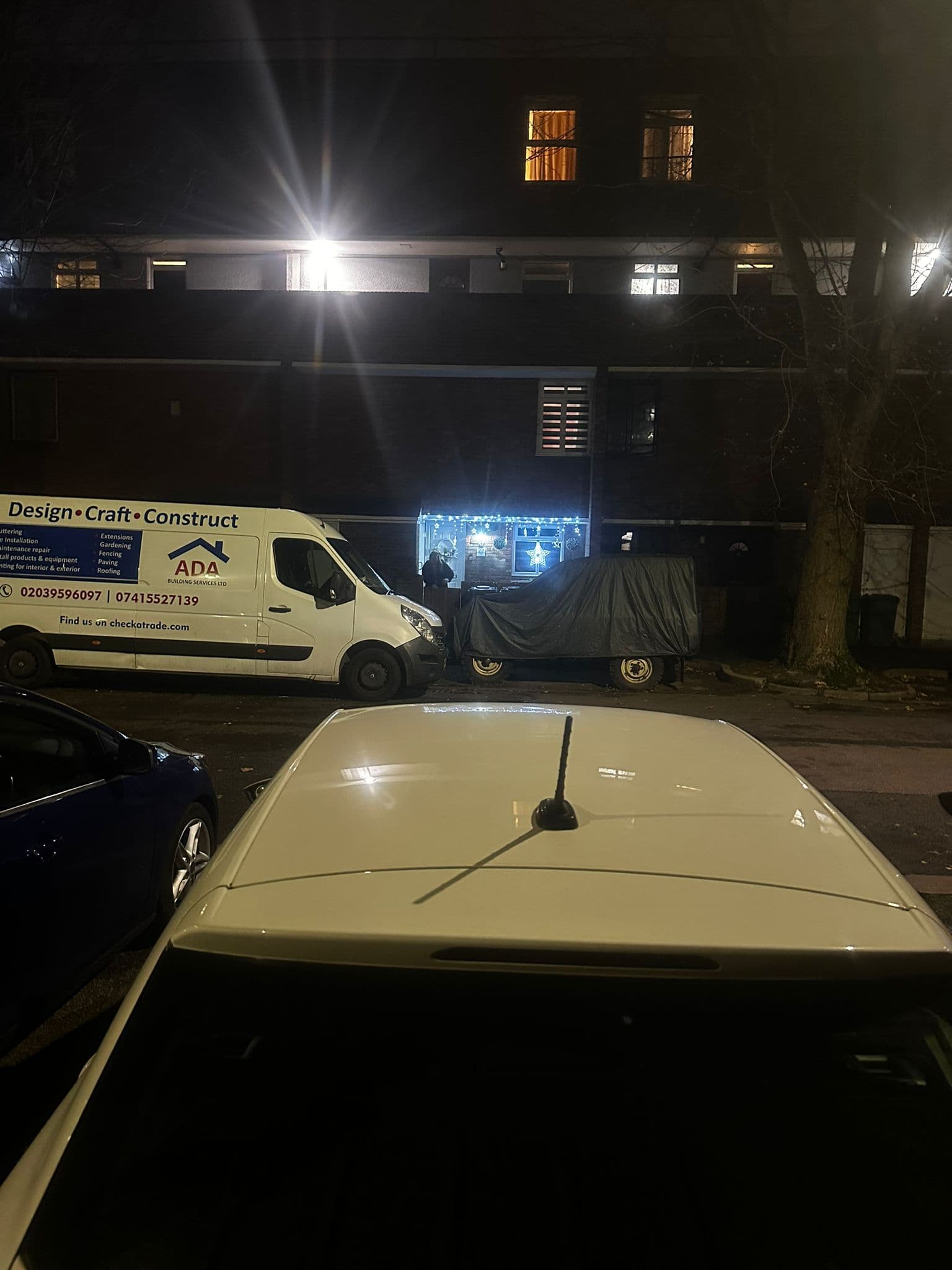 Ada Building Services branded van at night showing Design Craft Construct livery